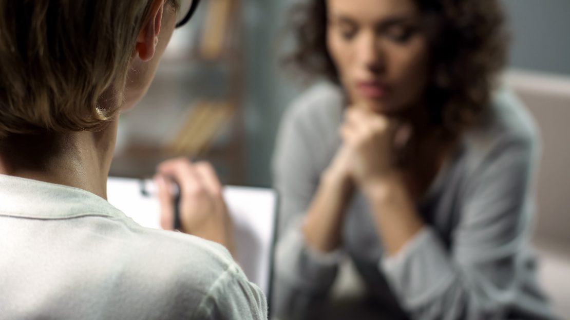 Young woman talking to a therapist