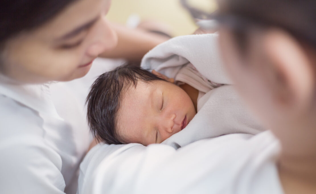 Asian parents with newborn baby