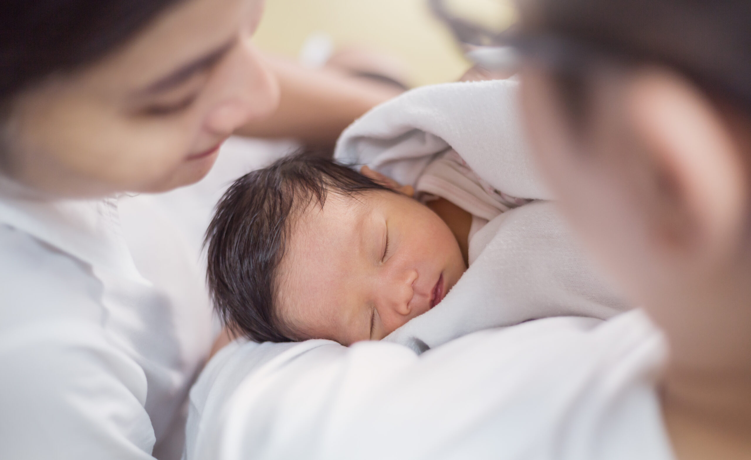 Asian parents with newborn baby