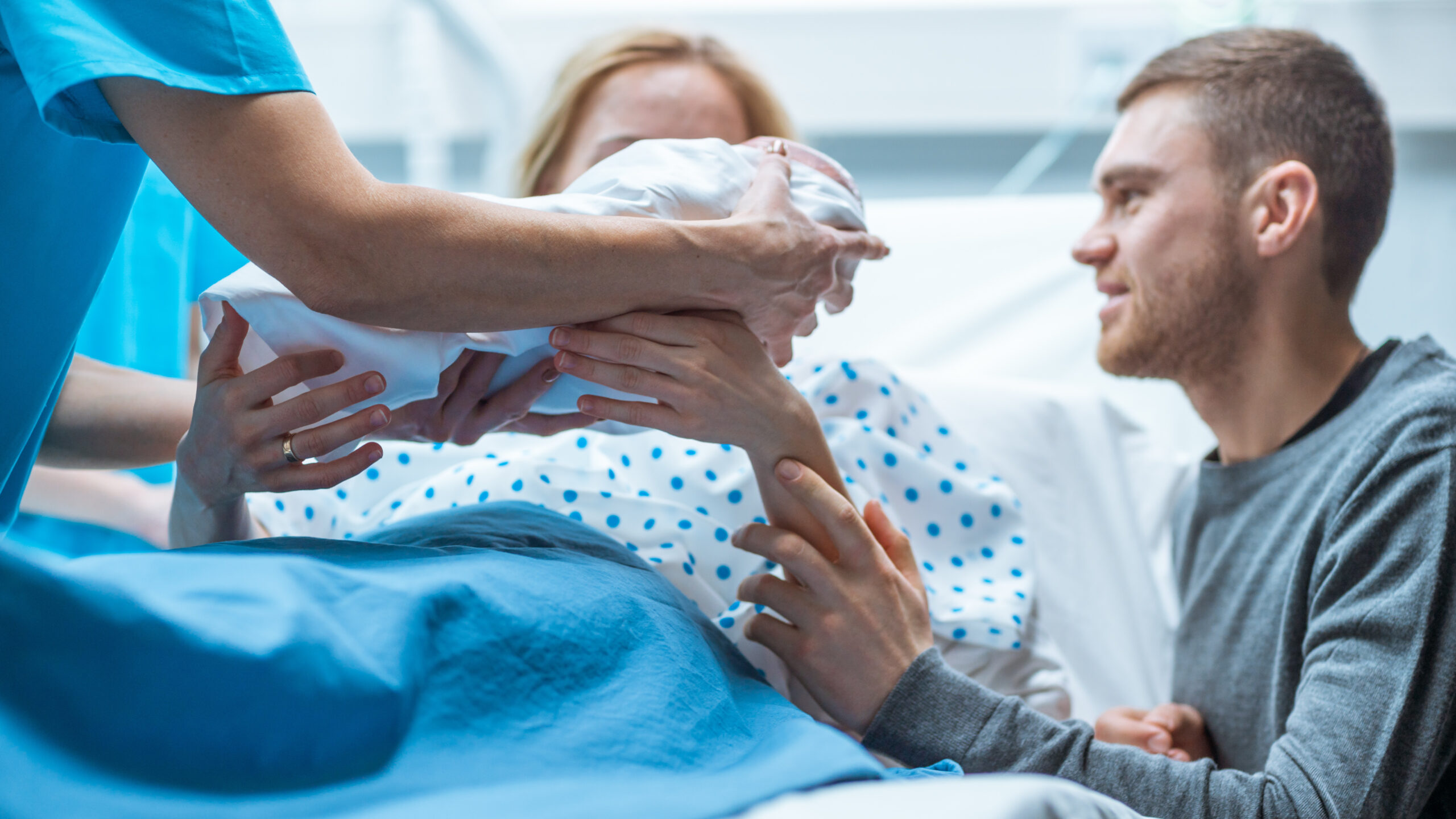 In the Hospital Midwife Gives Newborn Baby to a Mother to Hold