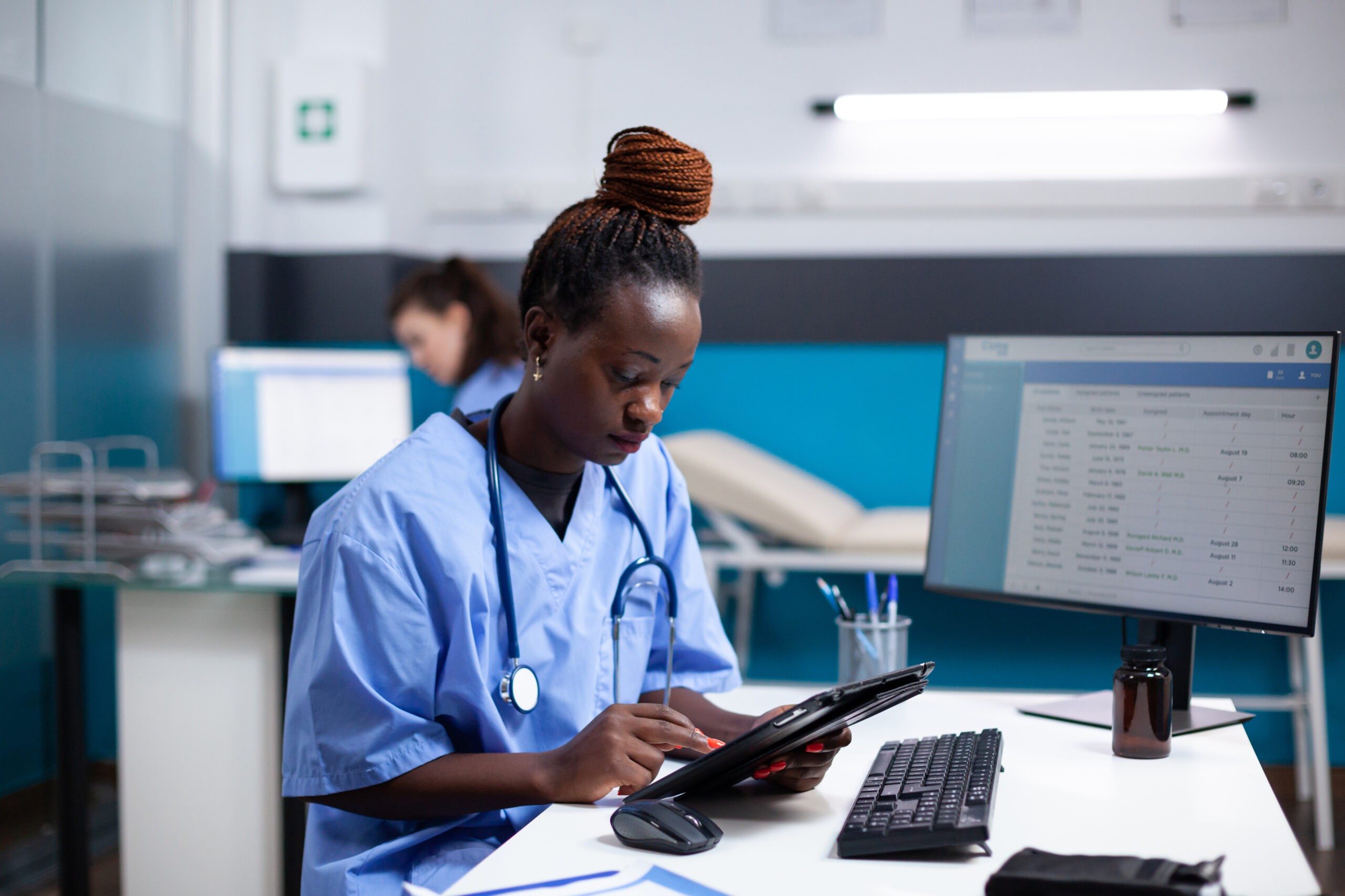 Healthcare worker looking up information on tablet
