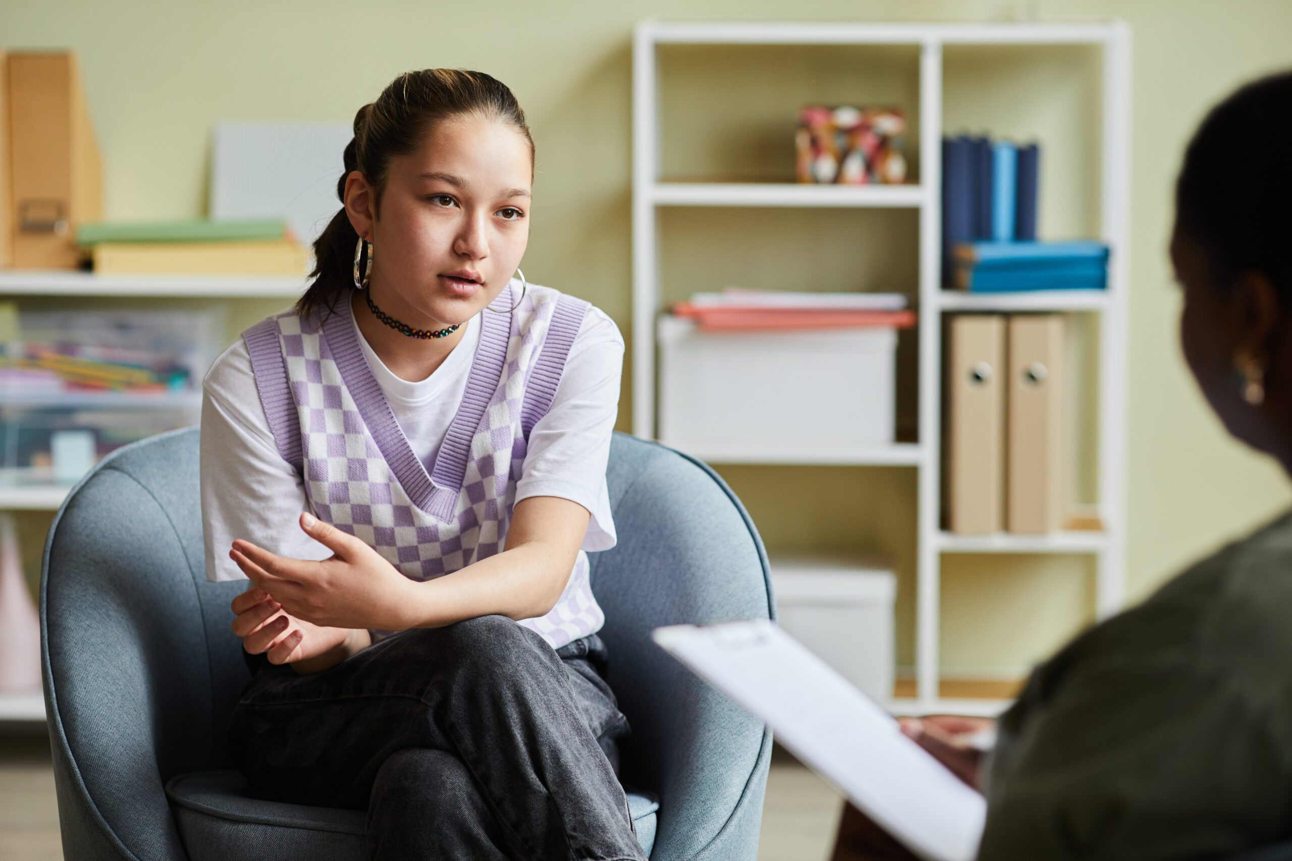 Teenage girl talking to therapist