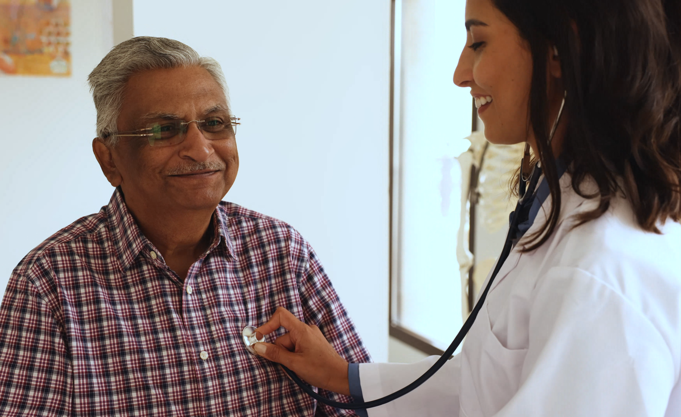 doctors stethoscope check on older male patient